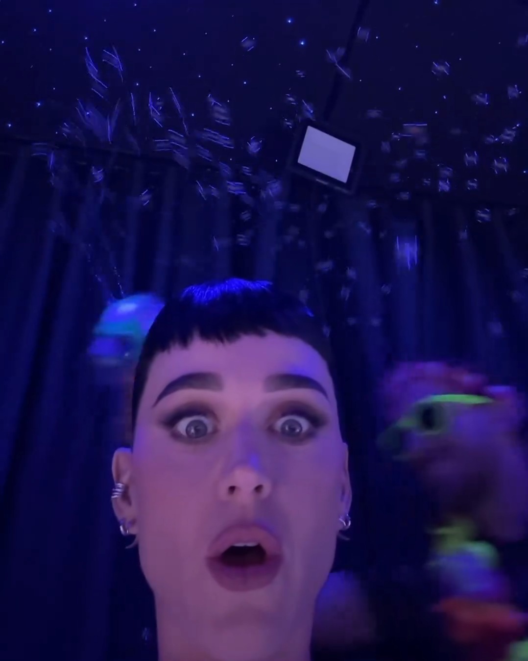 Katy Perry wide eyed during the show at Shelanous