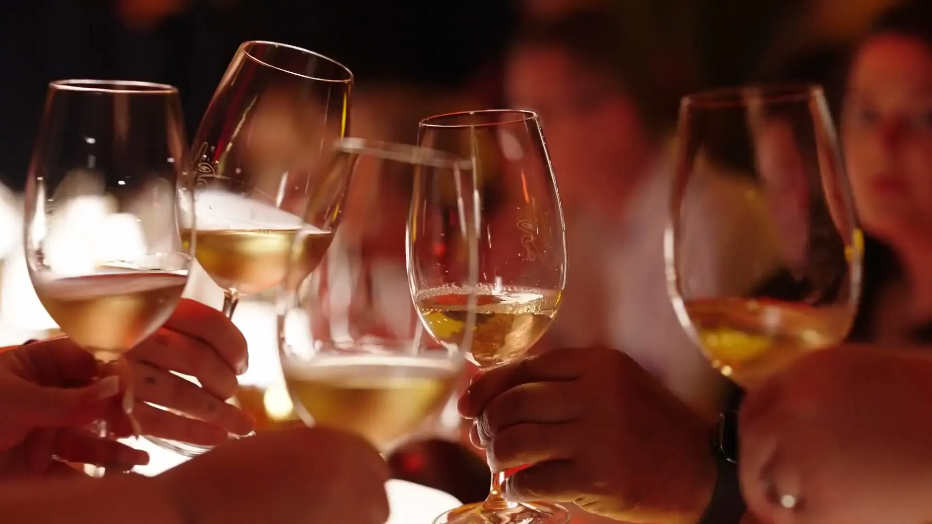 Glasses raised along the Shelanous long table