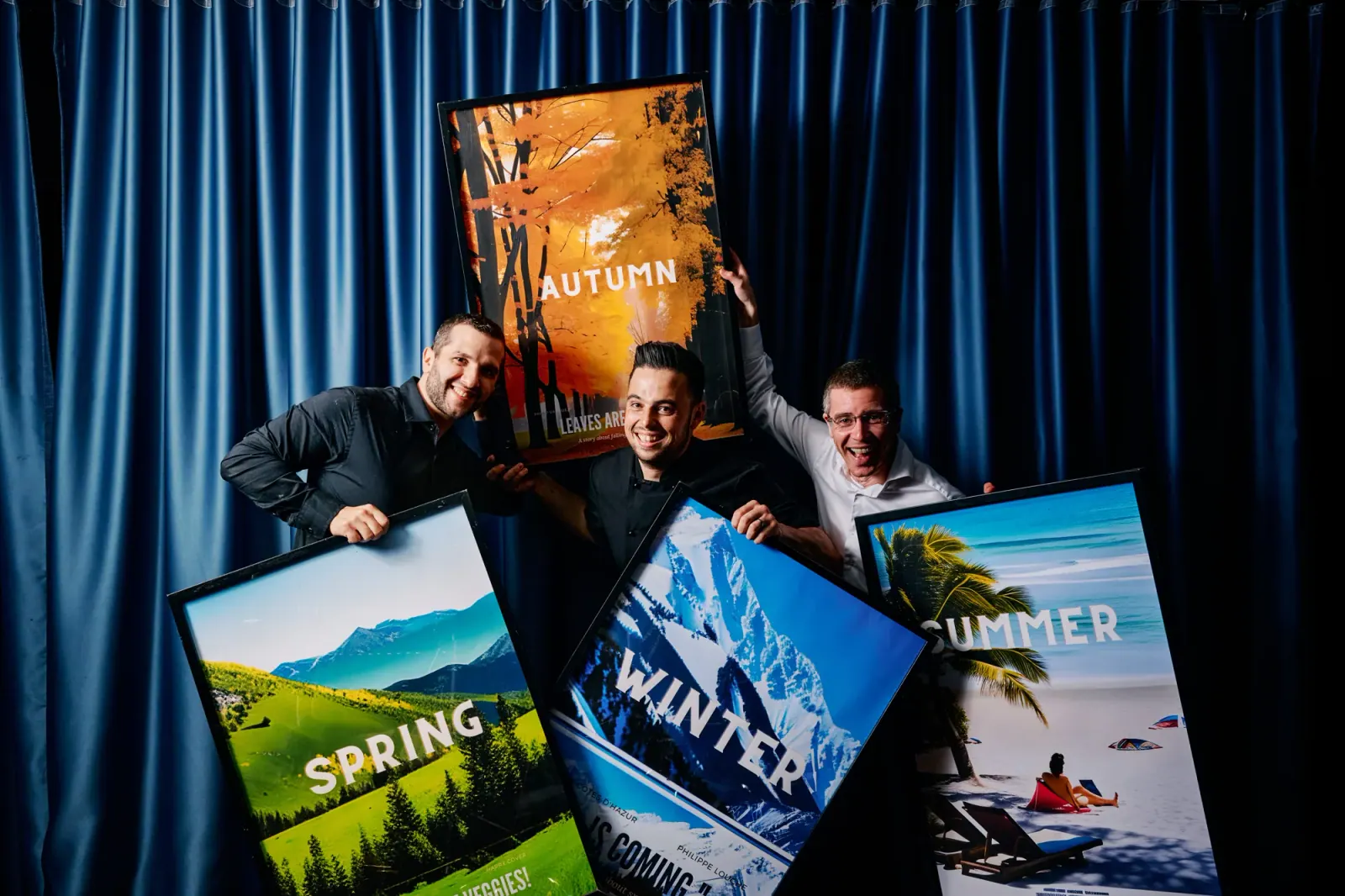 The Shelanous team with the four season posters