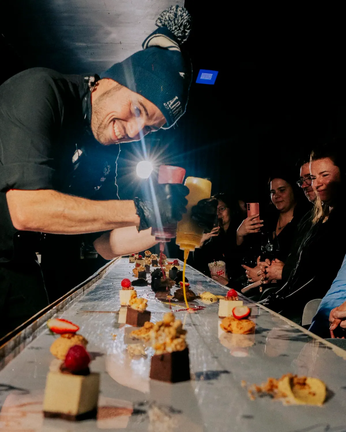 Chef Rony finishing dessert along the long table